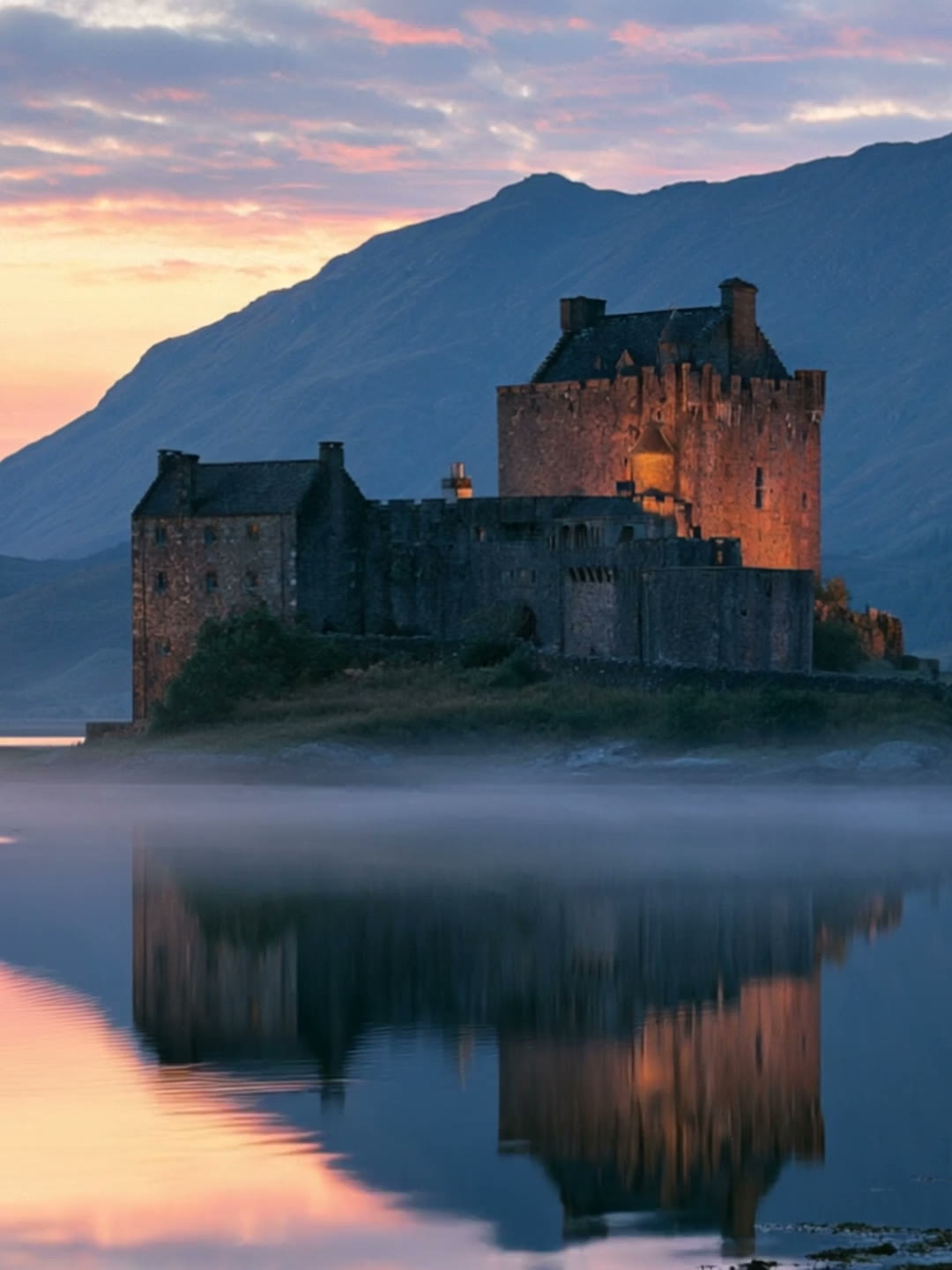 A sunset castle, green Scottish Highlands, a loch, stone village and misty glen